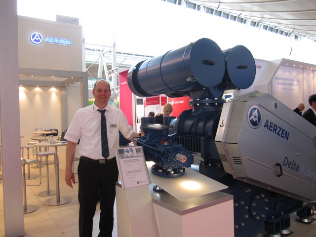 Stephan Brand, from Aerzen, in front of the new Delta Hybrid rotary lobe compressor model.